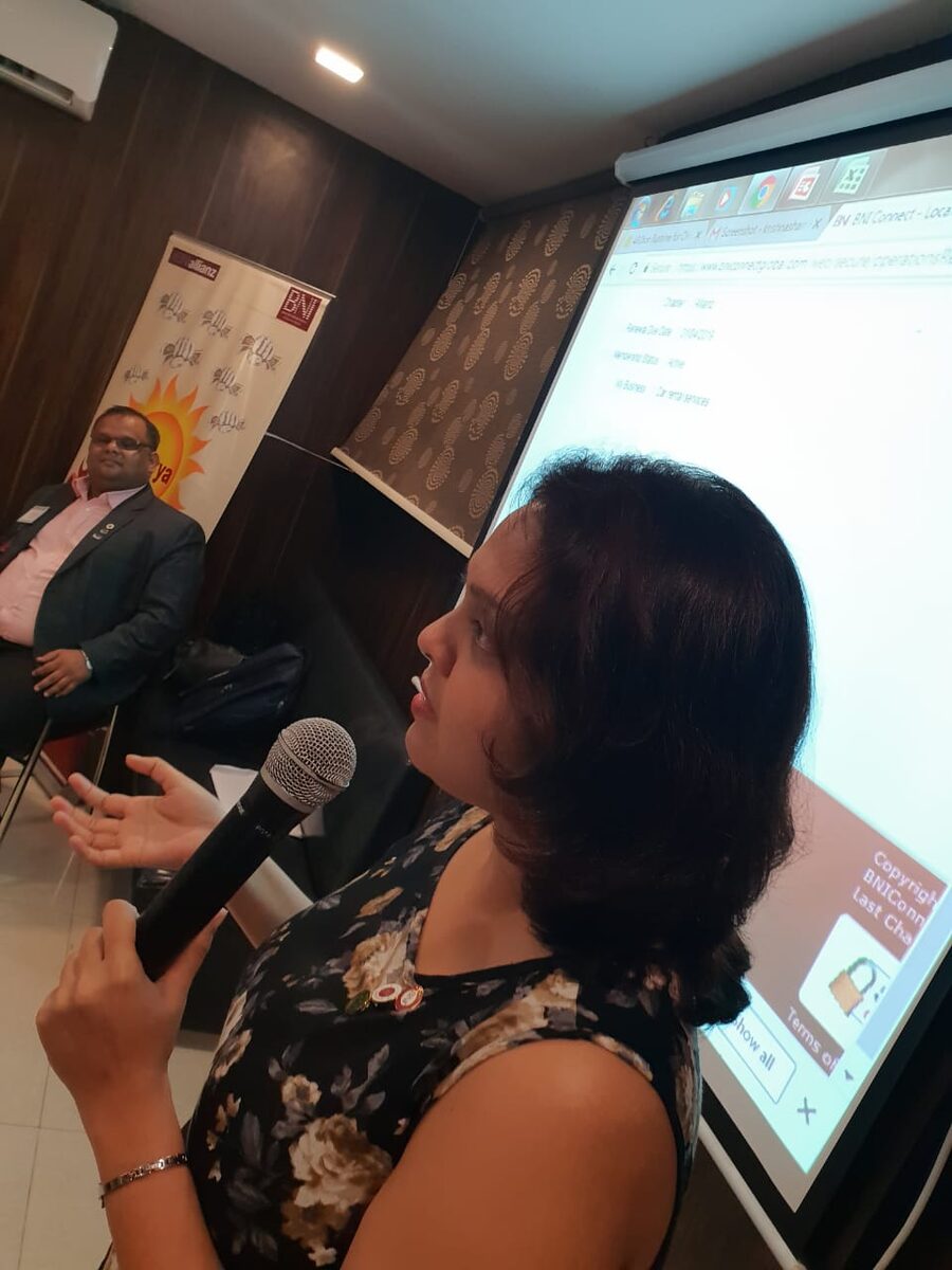Sudakshina presenting with a microphone